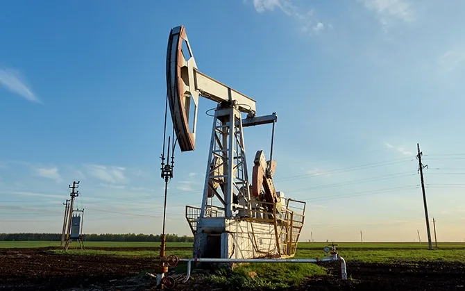 Oil and gas production site at sunset